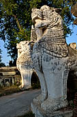 Myanmar - Inwa,  lions guarding enterance to Mahar Aung Mye Bon San Monastery 
